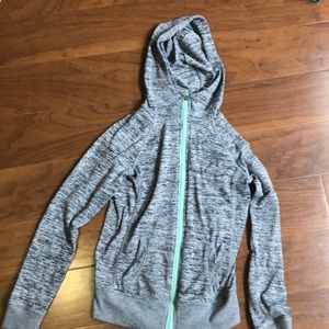 gray hoodie with mint green zippers